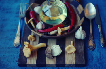 Forest picking mushrooms in wickered basket top view copy space/ table settings /Fresh raw mushrooms on the cutting board
