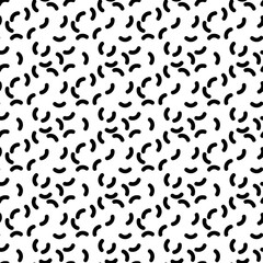 Seamless pattern of short curves. Black worms on white background. Abstract vector pattern.
