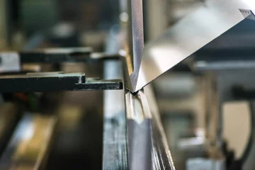 Fotobehang Sheet metal bending process. © Mb_creation