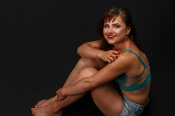 portrait of a young girl in sexy lingerie and shorts