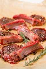 Raw lamb chops on a paper prepared for cooking on a cooking paper