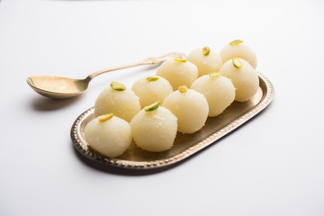 Indian Rasgulla or dry Rosogulla dessert/sweet served in a bowl. selective focus