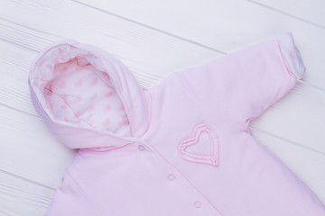 Pink hooded baby girl coverall.