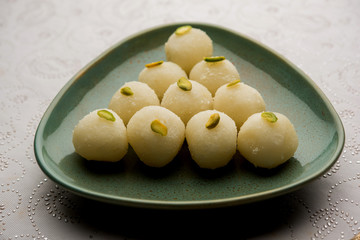 Indian Rasgulla or dry Rosogulla dessert/sweet served in a bowl. selective focus