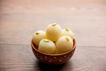 Indian Rasgulla or dry Rosogulla dessert/sweet served in a bowl. selective focus