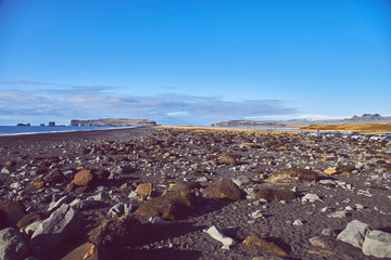 view of the shore with black sand in Iceland