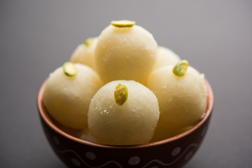 Indian Rasgulla or dry Rosogulla dessert/sweet served in a bowl. selective focus