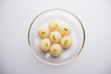 Indian Rasgulla or dry Rosogulla dessert/sweet served in a bowl. selective focus