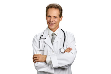 Fototapeta premium Happy caucasian doctor on white background. Cheerful medical worker with stethoscope folded arms on chest, portrait. People, medicine, healthcare.