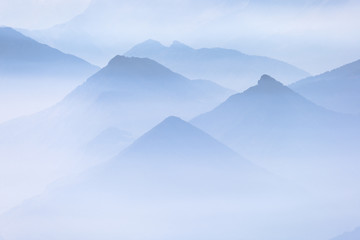 Blue layers of mountain ridges in the french alps