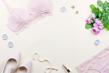 Fototapeta na wymiar Woman elegant pink lace bra and panties, pumps and jewelry. Stylish lingerie flat lay.