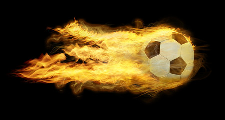 Classic soccer ball on fire on black background