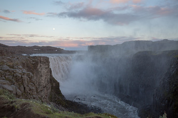 waterfall in iceland in the mountain