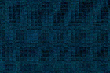 Navy blue background from a textile material with wicker pattern, closeup.