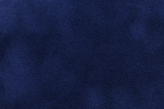 Background of dark blue suede fabric closeup. Velvet matt texture of navy blue nubuck textile Stock Adobe Stock
