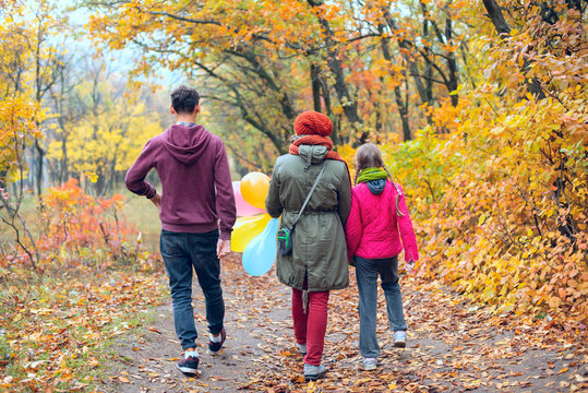 Joyful Family - Mom, Teenage Daughter And Son