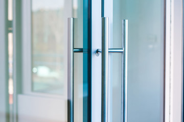 Close-up of Aluminum glass door handle.