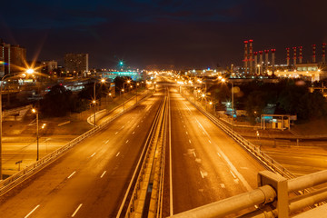 Fototapeta na wymiar Large road junction iin the city in night lights