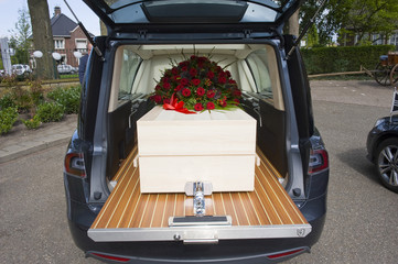 Coffin in funeral car