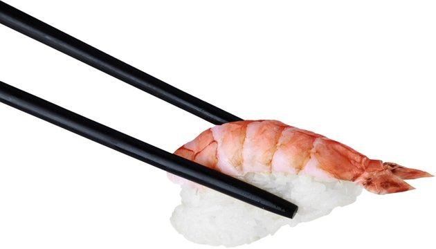 Black Wooden Chopsticks with Nigri Sushi - Isolated