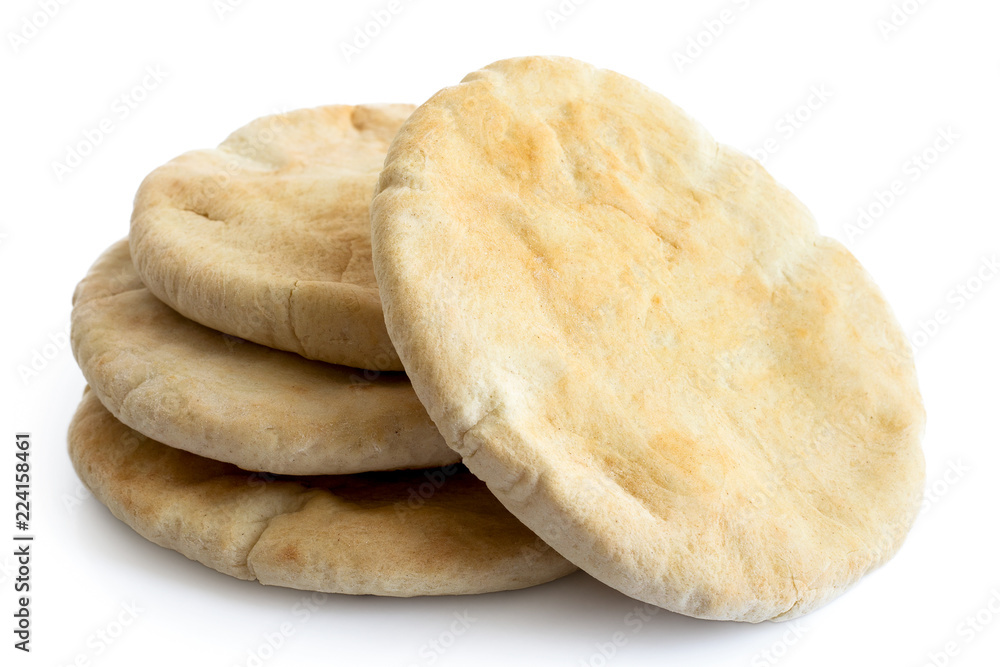 Wall mural a stack of pita breads isolated on white from above.