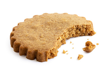 Partially eaten round gingerbread biscuit isolated on white. Serrated edge.