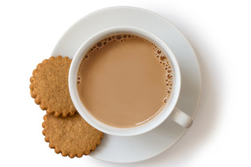 A cup of tea with milk and two gingerbread biscuits isolated on white from above. White ceramic cup...