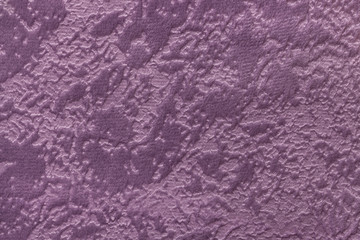 Violet background from a soft upholstery textile material, closeup.