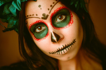 Young caucasian woman in catrina calavera style makeup horizontal portrait close up face