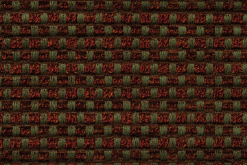 Fototapeta premium Dark red and green background from checkered pattern textile, closeup. Structure of the wicker fabric macro.