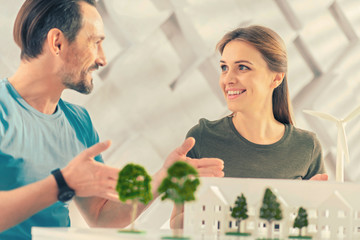 Lets work. Happy woman looking at her partner while working together in office