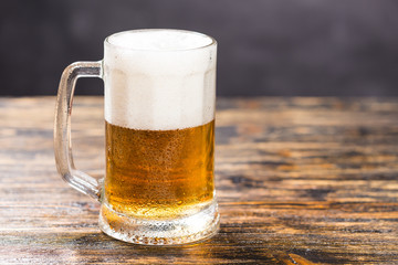 Alcohol, liquid, food concept - mug of beer on a table