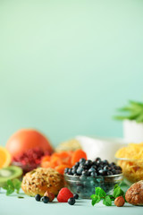 Vegetarian breakfast. Soft boiled egg, oat flakes, nuts, fruits, berries, milk, yogurt, orange,...