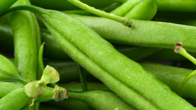 Macro shooting of a green beans rotating. Close up.