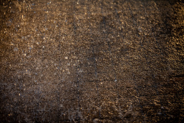 Splashes of water and bokeh of Water on a Sunset Background.