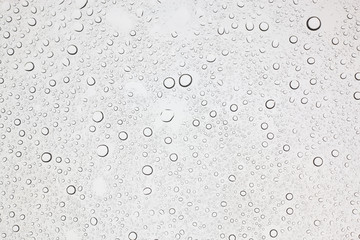 Fototapeta na wymiar Rain droplets on glass background, Water drops on glass.