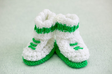 booties newborn baby. booties white green. knitted baby socks