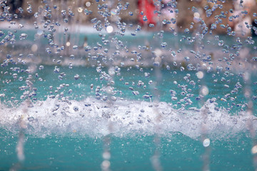 Splashing water from a fountain as a background