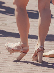 Legs of a girl with big heels