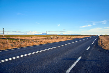 Fototapeta premium Asphalt road in Iceland, Autumn