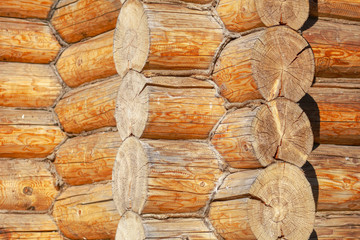Wall with log house in the house as a background