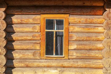 Window in the house with a log house