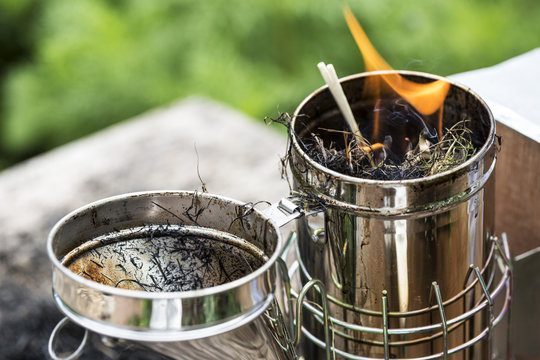 Close up of metal smoker used by beekeeper to calm bees.