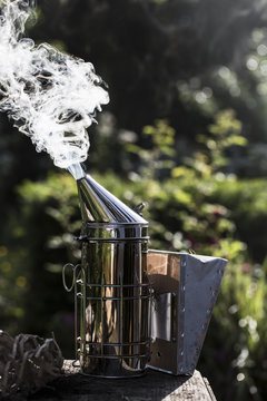 Close up of metal smoker used by beekeeper to calm bees.