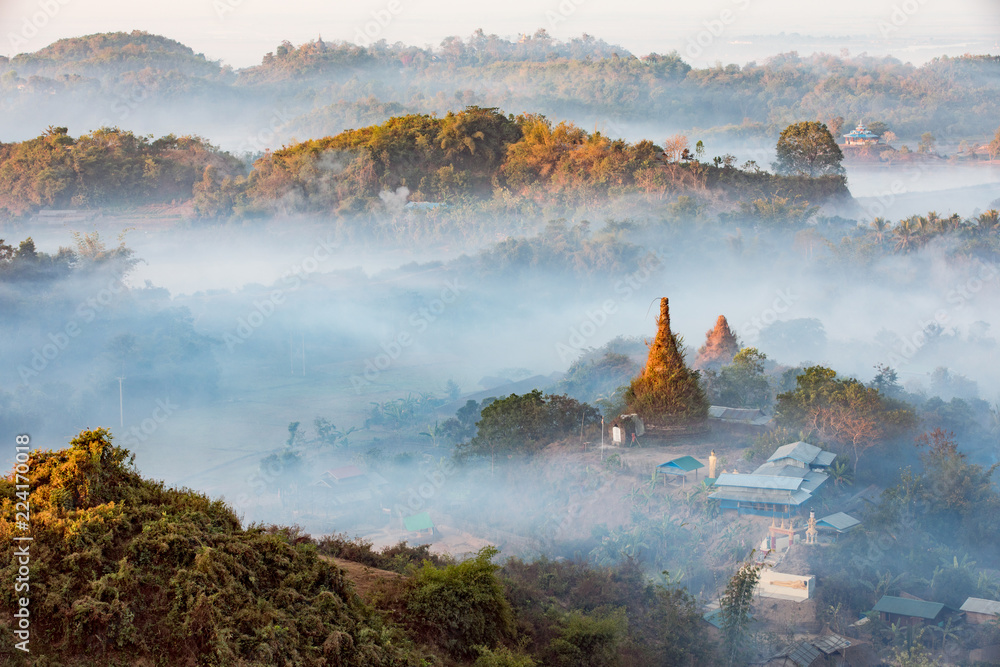 Wall mural buddha temple in the sunset dawn