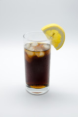 cold soda with ice and lemon