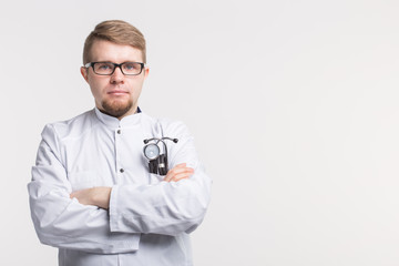 Medical doctor man with stethoscope over white background with copy space