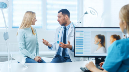 Plastic / Cosmetic Surgeon Consults Woman about Facelift Surgery. Nurse Works on Computer that...