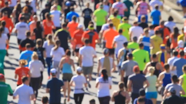 Crowd of athletes running at the marathon