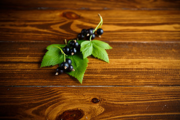 ripe berries black currants on a wooden table